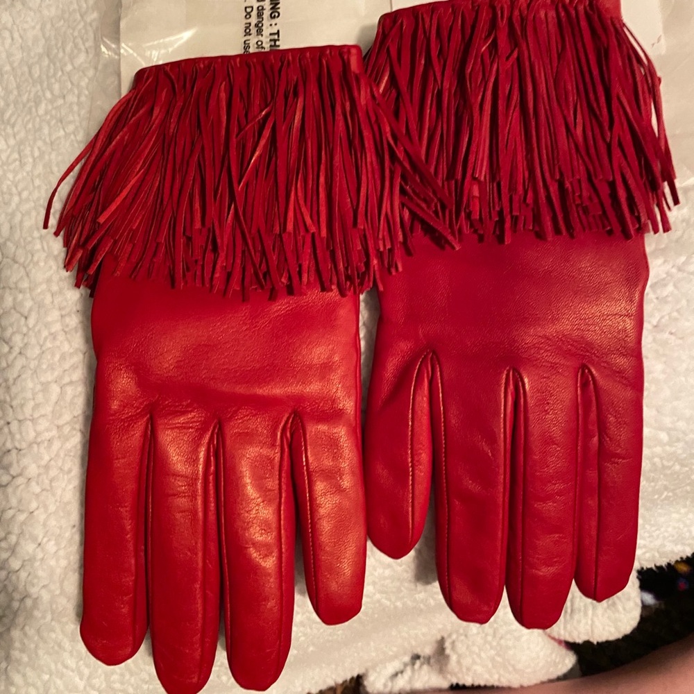 Diane von Furstenberg red fringe leather gloves.